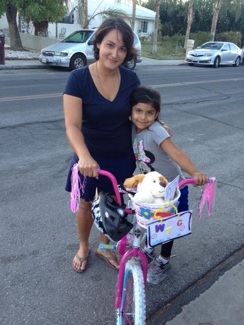 Team-building facilitator with one of the 10 bike recipients 1